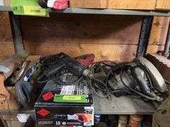 Shelf of various hand tools as shown