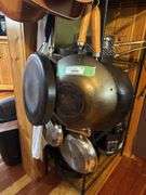 Cookware hanging on shelf - lots of skillets