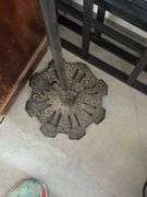 Antique cast-iron birdcage holder with vintage wooden cage