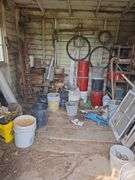 Contents of tool shed includes tool boxes, 2 floor jacks, 2 man saw, windows, buckets of charcoal, nail kegs, nails, pony shoes and more See photos, bring your gloves!