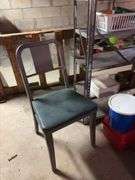 Metal shelving unit with contents, office chair, tool boxes and plastic stackable storage bins with empty coffee cans