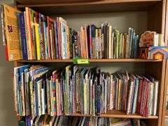 2 shelves of mostly kids books and young readers books