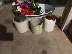 Large enamel tub with artificial flowers, two brown top jugs and a small crock