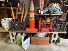 Pruning shears, metal plant holder, safety cone, wood pieces, boot jack, clothes hangers, etc