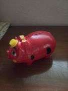 Three piggy banks and one pig with Grand Rapids Minnesota advertising