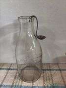 Half gallon milk bottle and cream spoon and painted jar