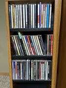 Panasonic DVD/CD player and CDs and storage tower