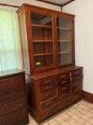 26D x 56L x 90H two piece kitchen cupboard with glass front doors on top and 15 drawers on bottom May need tools to take apart