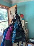Heavy duty wooden hall tree loaded with bags and umbrellas Kinda cool, it has umbrella rests!!