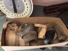 Hansen Model 2000 utility scale, two small sad irons, butter pat mold, Manson Tape tin, husking pegs