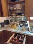 Plastic mixing bowls with lids, dishes, drawer of flatware, glassware, small CorningWare casseroles, etc