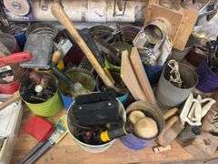 Large quantity of hand tools on top of bench
