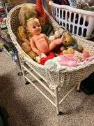 Old and older dolls, bassinet and stand