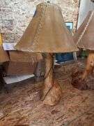Two heavy burled pine lamps with rawhide shades