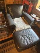 Pair of arm chairs with ottomans - both have large wear spots