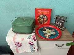 Vintage kitchen items includes Betty Crocker cookbook, serving trays, toaster and cake server