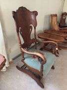 Antique oak platform rocker with needlepoint seat, veneer has small chip on back