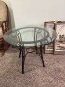 26" round glass top wrought iron leg table