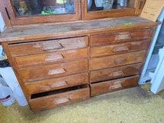 2pc oak cupboard with glass door top and 10 drawer base 26D x 56L x 90H Bring tools to take apart!
