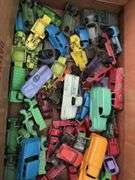 Box of toy cars, many appear to be Tootsie Toys