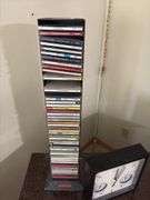 TV stand 19D x 42L x 24H, VHS/DVD player, tapes, CDs, clock/thermometer/humidistat