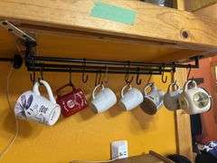 Three section storage bin, hanging coffee cup storage and drinking glasses