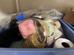 Tote of wood craft items, embroidery kits and string and a box of paper, tins and misc