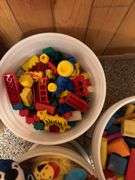 Duplo large Lego blocks, bucket of stuffed animals, bucket of wooden blocks