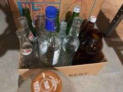 Various glass bottles and jars includes blue glass, Coca-Cola 1 gallon bottle, old soda bottles, etc