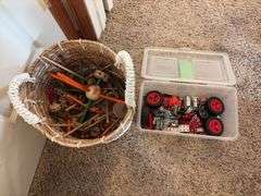 Basket of large tinker toys and Erector set pieces