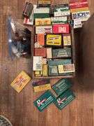 Grocery sack and box full of old cartridge boxes, most empty, some have hulls. Good man cave decor