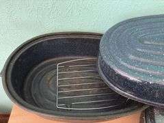 Three granite ware roasters and a hot food tray