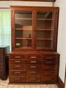 26D x 56L x 90H two piece kitchen cupboard with glass front doors on top and 15 drawers on bottom May need tools to take apart