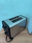 Hamilton Beach two slice toaster (like new), Rival hand mixer appears to be NIB and an old GE iron