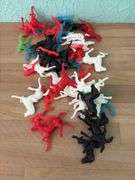 Plastic cowboys, Indians and horses and six lead soldiers