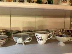 Lots of cute knick knacks and cups & saucers (We don’t know if they match!)