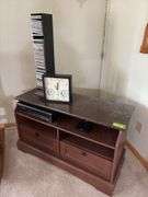 TV stand 19D x 42L x 24H, VHS/DVD player, tapes, CDs, clock/thermometer/humidistat