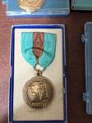 DeKalb, IA high school music association and Hoover trail medallions
