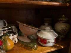 Two shelves of glassware - juice pitcher, soup bowls, cups, trays, china items