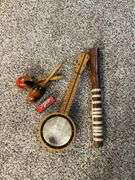 Rain stick, mini banjo, harmonica and maracas