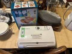 Food saver sealer, bag of sealer bags and steak plates