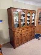Kraus Furniture Amana walnut hutch with 4 glass doors on top, 5 drawers and 4 door base 22D x 66L x 73H NO CONTENTS, needs to  be a LATE PICK UP TIME!!