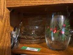 Two shelves of glassware - juice pitcher, soup bowls, cups, trays, china items