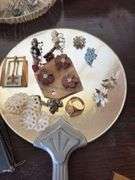 Various costume jewelry, dresser mirror, fingernail sets, watches, etc