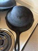 Two cast iron skillets - one lid, one wagner