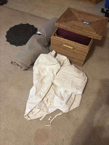 Basket with pillows, large roll of canvas shade cloth and large canvas US marked bag image