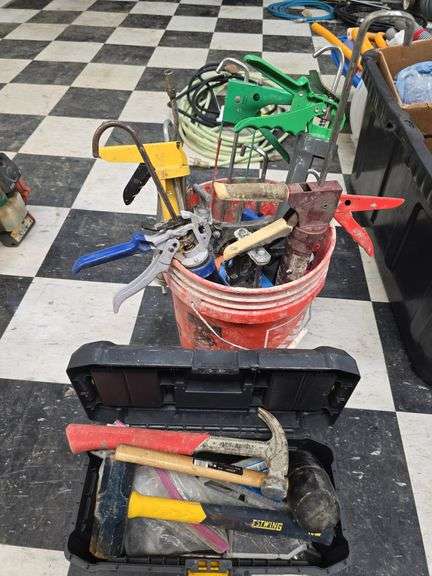Bucket of caulk guns and toolbox of tools, hammers etc... image