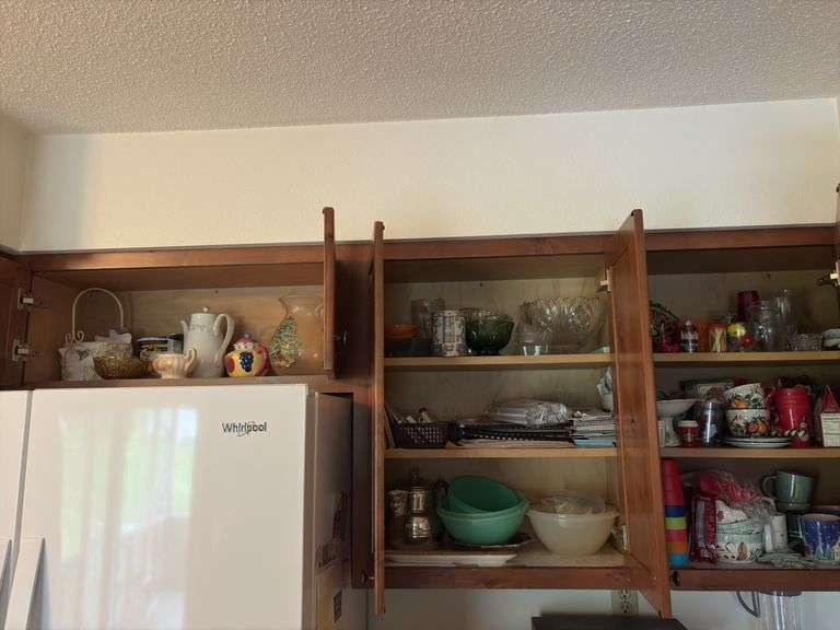 Tupperware, silverplate, cookbooks, glassware, coffee mugs, etc "A" cupboards image