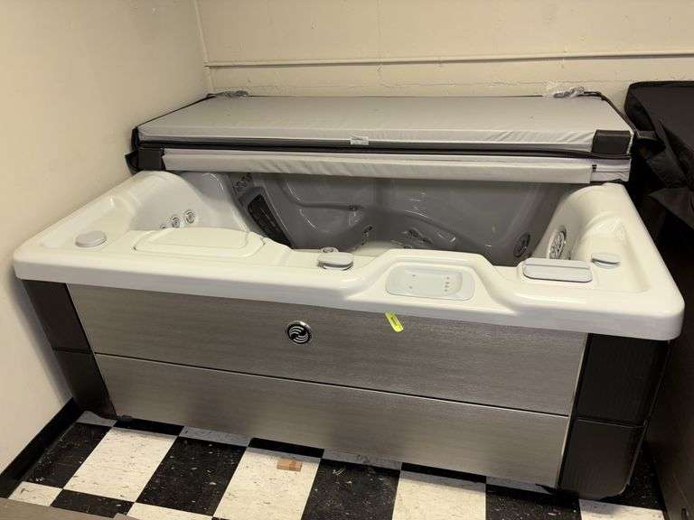 Hot Springs Spas? 70x82x32 hot tub with cover  These are untested floor model hot tubs, sold AS IS image