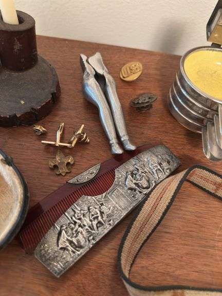 Assorted smalls includes merscham style pipe, ice cleats, pocket knives, old razor, bullets, gal on leg nut cracker, ash tray set w/matching holder and more